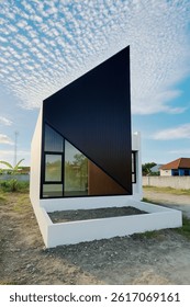 Unique Geometric Facade Under Dramatic Sky