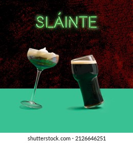 A Unique Irish Coffee Glass And Pint Of Black Stout Craft Beer Glass In Front. Irish Gaelic Slainte Or Cheers In English Green Neon Sign Above. Dancing Glasses Modern Concept. Plum Concrete background