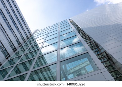 Unique low angle building perspective. bright sun reflecting on the glass of the modern building. shot in the netherlands. - Powered by Shutterstock