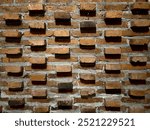 unique pattern brick wall background. brick wall background with weathered bricks and cement joints