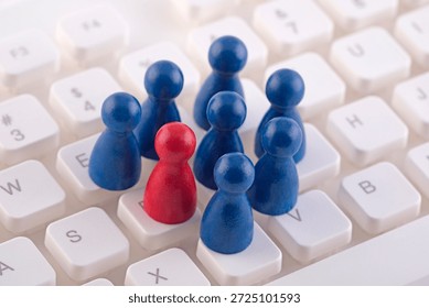 Unique person in the crowd on computer keyboard