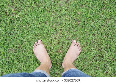 Unique Perspective Barefoot Relax On Grass Green Background