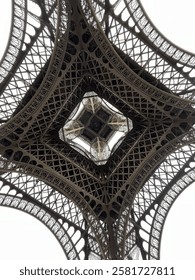Unique perspective of the Eiffel Tower from the bottom.  Looking straight up the center of the steel structure to see the intricate details. 