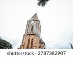 unique rustic stone architecture and clock tower of the Cathedral of Our Lady of Mount Carmel built in 1902.
