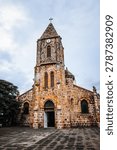 unique rustic stone architecture and clock tower of the Cathedral of Our Lady of Mount Carmel built in 1902.