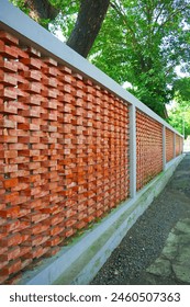 A Unique Structured Brick Wall in a Mountain Pond Park Parking Lot. The Bricks are Stacked and Set in an Unusual Pattern. Location Bogor, Indonesia.