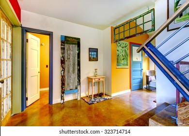 Unique And Very Colorful Interior To American Home With Hardwood Floor And Metal Staircase. 