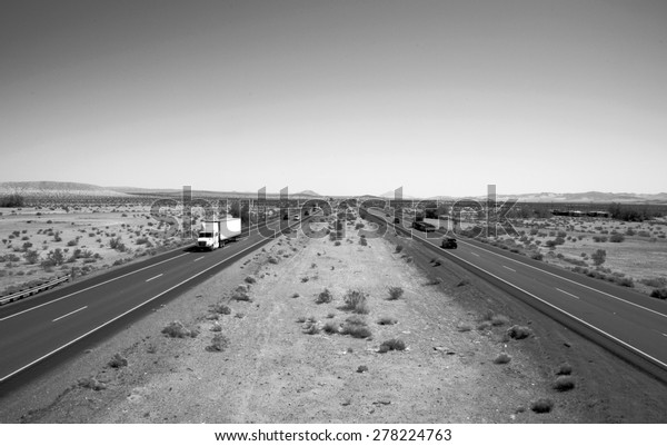 Unique View of the Interstate 15 Freeway from an\
overpass heading North towards Las Vegas, Nevada and South towards\
Los Angeles California. I15 is the main freeway between Las Vegas\
and Los Angeles
