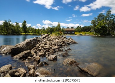 A Unique View Of A Rock Path Leading Towards A Cabin On Moosehead Lake, In Rockwood, Maine.