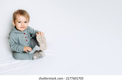 Unisex Clothes For Babies. Cute Baby In Cotton Set Suit On Light Background. Kids Fashion