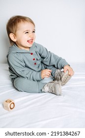 Unisex Clothes For Babies. Cute Baby In Cotton Set Suit On Light Background. Kids Fashion