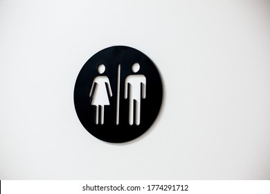 Unisex Restroom Sign On White Door At A Medical Dental Office Private Practice Or Hospital