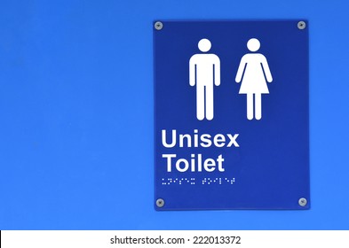 Unisex Toilet Sign And Symbol On A Public Blue Restroom Door. Concept Photo Of Sex And Gender Distinction. No People. Copy Space