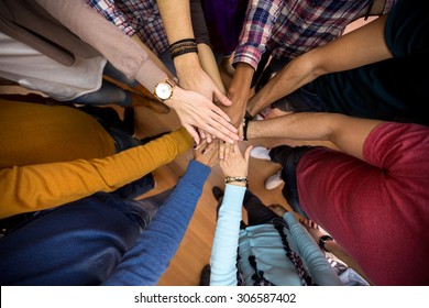 Unit and concord in multiethnic team, all hands together  - Shutterstock ID 306587402