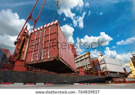Unit of container being load by the ship gears crane onto the vessel, transit of the cargo and shipment in the port from tha land to the sea transports under concept logistics system services