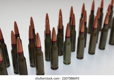 Unitary Cartridges With Copper Alloy Shell Bullets Lined Up Top View Stock Photo