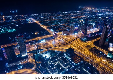 United Arab Emirates Dubai 07/14/2014 downtown dubai futuristic city neon lights and sheik zayed road shot from the worlds tallest tower building in Dubai - Shutterstock ID 351869831