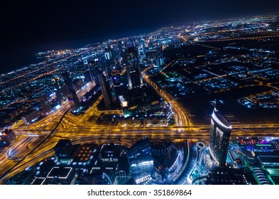 United Arab Emirates Dubai 07/14/2014 downtown dubai futuristic city neon lights and sheik zayed road shot from the worlds tallest tower building in Dubai - Shutterstock ID 351869864