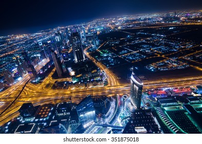 United Arab Emirates Dubai 07/14/2014 downtown dubai futuristic city neon lights and sheik zayed road shot from the worlds tallest tower building in Dubai - Shutterstock ID 351875018