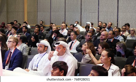 United Arab Emirates, Dubai - October 2017: Business Partners Discussing Documents And Ideas At Meeting. Conference Blockchain In Dubai