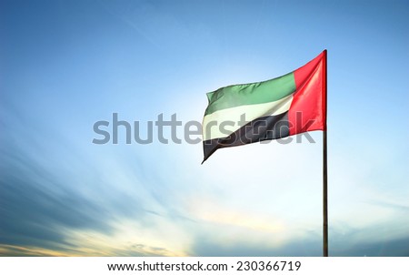 A United Arab Emirates flag flying against clean and tranquil sky. UAE celebrates it's national day on 2nd December every year.