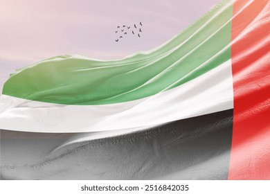 United Arab Emirates national flag fluttering with birds. The flag blowing in beautiful soft sky. UAE national flag for independence day. - Powered by Shutterstock