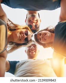 United In Friendship. Low Angle Shot Of A Group Of Happy Young Friends Posing Outside.