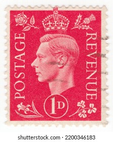 UNITED KINGDOM - 1937: An 1 Pence Scarlet Postage Stamp Showing Portrait Of King George VI With Crown And Flowers