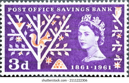 United Kingdom - circa 1961: a postage stamp from United Kingdom , showing a portrait of Queen Elizabeth. a stylized tree with a squirrel. Growth of Savings. Text: Post Office Savings Bank 
