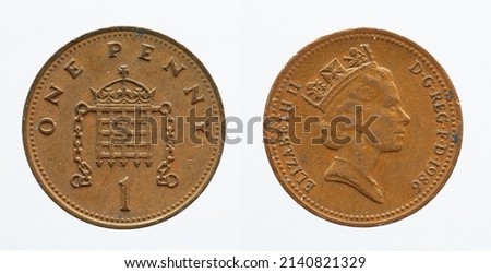 UNITED KINGDOM - CIRCA 1986: One penny coin from United Kingdom showing a portrait of Queen Elizabeth II and a crowned portcullis with chains above the denomination 
