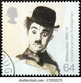 UNITED KINGDOM - CIRCA 1999: a stamp printed by UNITED KINGDOM shows image portrait of famous English comic actor and filmmaker Sir Charles Spencer "Charlie" Chaplin, circa 1999.