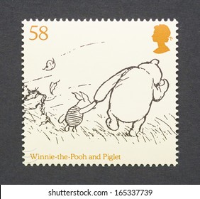 UNITED KINGDOM - CIRCA 2010: a postage stamp printed in United Kingdom showing an image of cartoon characters teddy bear Winnie-the- Pooh and the pig Piglet, circa 2010.  