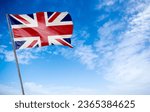 United Kingdom Flag - The classic flag of the United Kingdom waving proudly. Also known as the Union Jack, this flag features a captivating blend of red, white, and blue with the distinctive cross