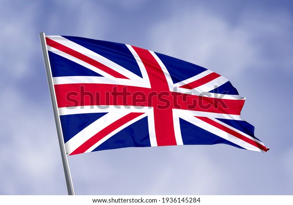 United\
Kingdom flag isolated on sky background. close up waving flag of\
United Kingdom. flag symbols of United\
Kingdom.