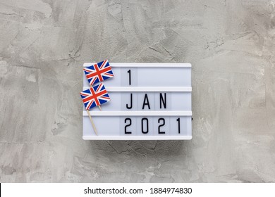 United Kingdom Flags And Text 1 January 2021 On Gray Background. Brexit, UK EU Trade Deal, Transition Period, Changes And New Rules Concept. Flat Lay, Copy Space