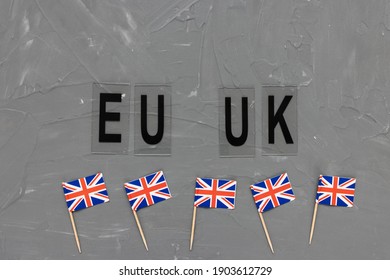 United Kingdom Flags And Text EU UK On Gray Background. Brexit, Travelling, Visiting, Trade Deal, Transition Period, Changes And New Rules Concept. Flat Lay, Copy Space