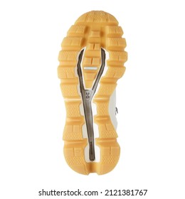 United Kingdom, London - January 22, 2022 Yellow White Shoes Sole Of Helly Hansen Men's Fall Winter Hiking Boot Isolated On White. Bottom View Mesh Shoes With Soft Sole. Modern Footwear