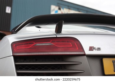 United Kingdom, Manchester April 2021.The Rear Section Of A 2013 Audi R8 V10 Plus With Optional Carbon Fibre Rear Wing And Red R8 Rear Badge With LED Rear Lights