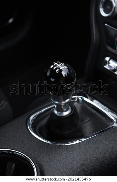 United Kingdom, Manchester August 2021. An\
Automatic Gearbox Gearstick Of 2015 Ford Mustang GT With Gloss\
Black 6 Speed Manual\
Gearstick.
