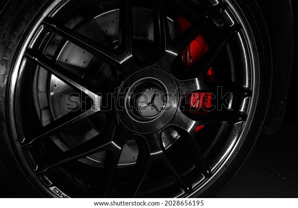 United Kingdom,\
Manchester August 2021.The Front Satin Black With Silver Lip Alloy\
Wheel With centre Locks On A 2020 Black Mercedes Benz S63 AMG With\
Red AMG Brake Callipers