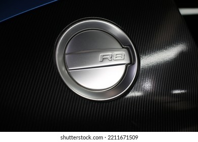 United Kingdom, Manchester January 2017.The R8 Silver Fuel Door Cap Logo On The Carbon Fibre Side Blades On A 2010 Audi R8 Supercar