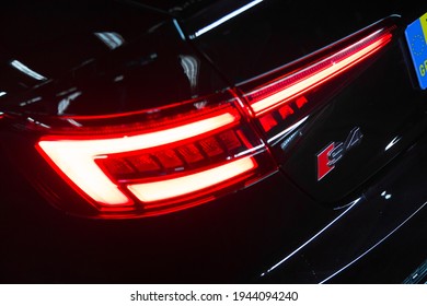 United Kingdom, Manchester March 2021. The Rear Tail Light And Model Designation S4 Badge On A 2017 Audi S4 Saloon In Black