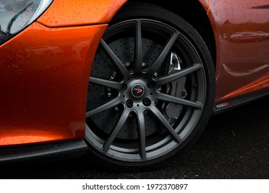 United Kingdom, Manchester May 2021.The Front Satin Grey Alloy Wheel Of A Volcano Orange 2015 McLaren 650S Coupe Supercar