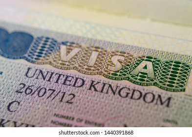 United Kingdom Multiple Entry Visa (Type C) sticker in the passport, for Business and Pleasure. Macro photo.