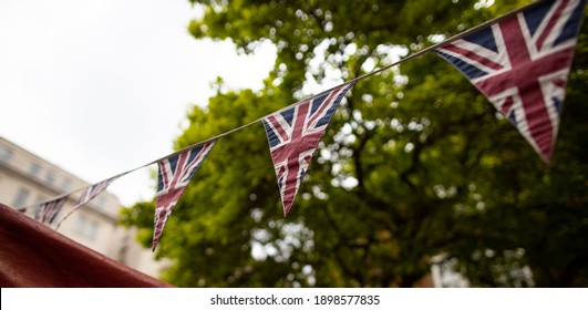United Kingdom triangle flags hanging on a line - Shutterstock ID 1898577835
