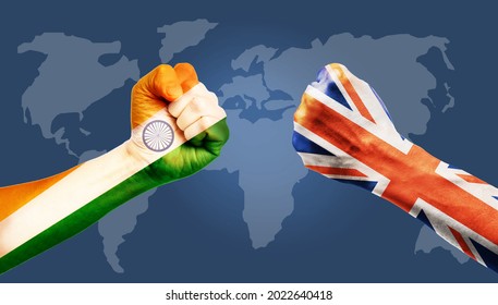 United Kingdom Vs INDIA Concept, Hands Painted India Flag And United Kingdom Or UK Flag On Hands Punch To Each Others On World Map Background