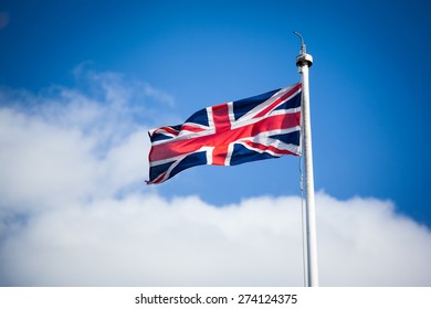 United Kingdon Flag With Blue Sky And Cloud