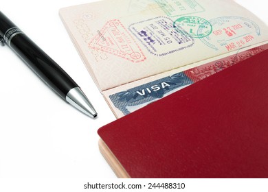 united state Visa with passport and pen over isolated background - Shutterstock ID 244488310