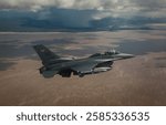 A United States Air Force F-16D Fighting Falcon fighter aircraft conducts low-level surface attack tactics and low-altitude navigation training over the Utah Test and Training Range on May 17, 2017.