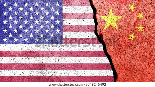 United States of America and China\
flags painted on the concrete wall. USA and China trade\
war